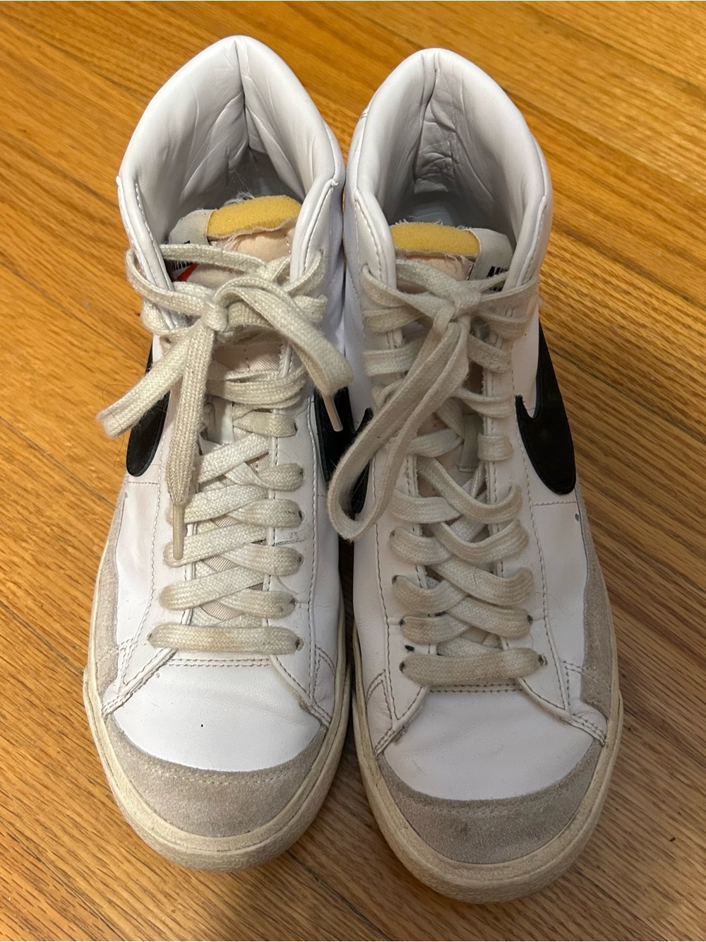 Nike White High-Top Sneakers with Black Swoosh